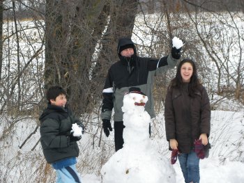 Jonah Sam and Gary making a snowman